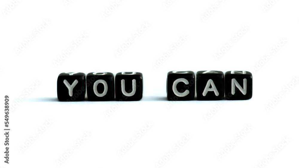 You can motivation quote made of black letter beads on white background. Inspirational speech.