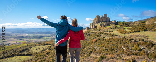 couple traveling in Aragon,  Loarre castle in Spain photo