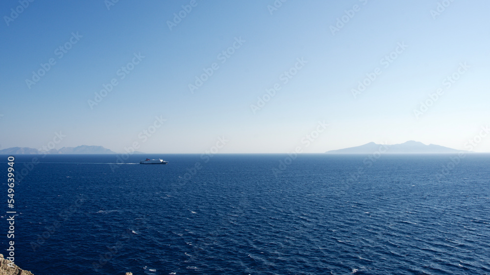 Cargo ship at sea. transit ship. Sailboats. Fishing boat. Fishing ship. Sightseeing Boat. Boat, ship floating in blue waters. Sunburns and ship reflecting from the sea. Cargo ship at sea. transit ship. Sailboats. Fishing boat. Fishing ship. Sightseeing Boat. Boat, ship floating in blue waters. Sunburns and ship reflecting from the sea.