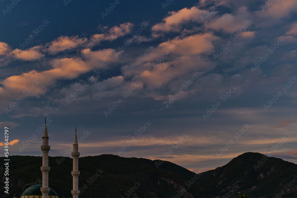 Early morning. Sunrise illuminates the minarets, the beginning of winter and the rainy season on the mediterranean coast