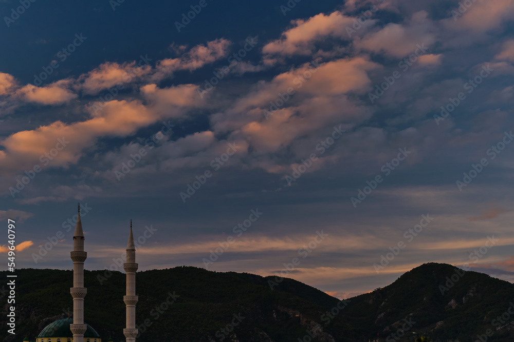 Obraz premium Early morning. Sunrise illuminates the minarets, the beginning of winter and the rainy season on the mediterranean coast