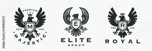 Eagle crest logo set. Heraldic flying falcon bird icons. Royal hawk shield monogram brand design label collection. Vector illustration.