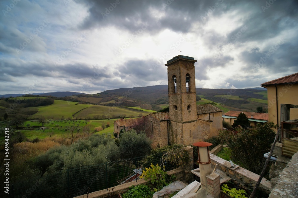 church in the mountains image taken in san gimignano, tuscany, italy