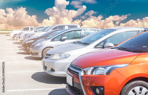 Car in stock for sale inventory. Car park outdoor in a row, automobile transportation dealer business concept