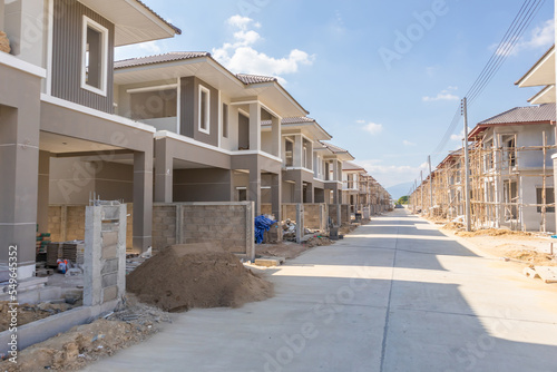 construction residential new house in progress at building site housing estate development © Piman Khrutmuang