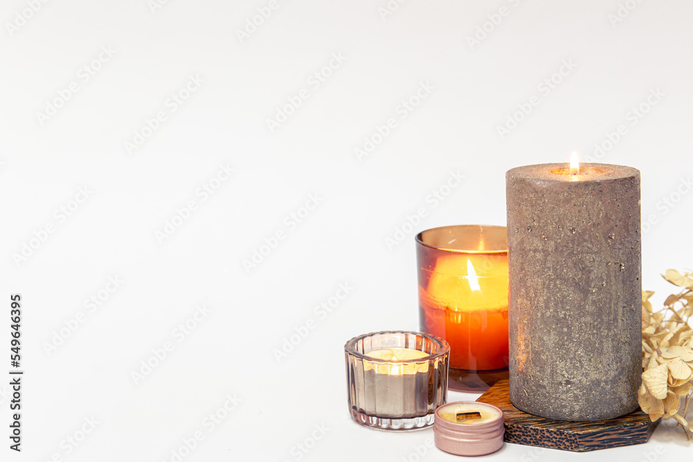 Burning candles on a white background isolated. Burning candles on a white background isolated.