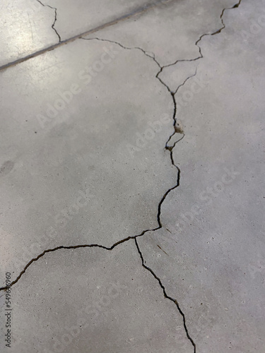 Cracked concrete. Industrial building, public place. Safety