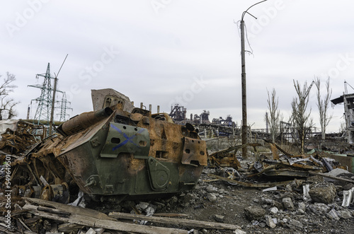 burnt tank and destroyed buildings of the Azovstal plant shop in Mariupol