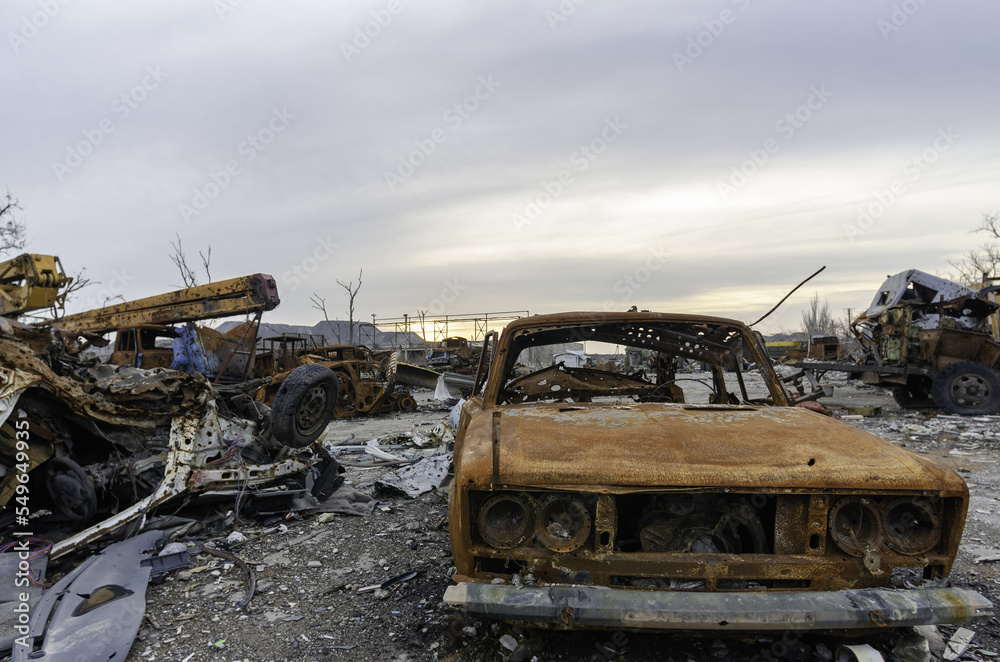 burnt cars and destroyed buildings of the workshop of the Azovstal plant in Mariupol
