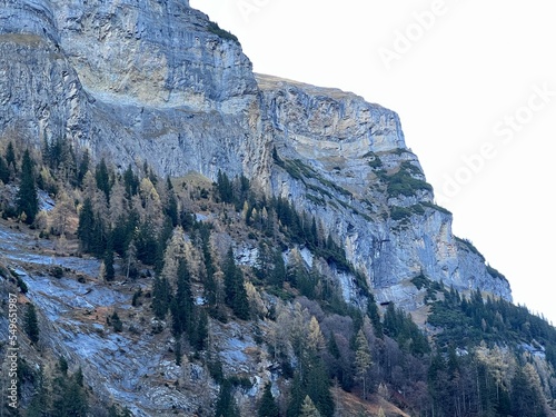 Steep stone cliffs and vertical rocks above the reservoir lake Gigerwaldsee (Gigerwald Lake) in the UNESCO World Heritage Tectonic Arena Sardona (UNESCO-Welterbe Tektonikarena Sardona) - Switzerland