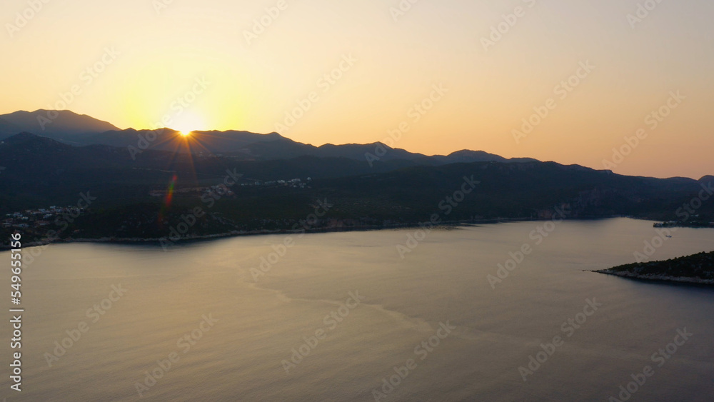 Stunning view of sea bay at sunset time. Beautiful resort town. Nature panorama from above.