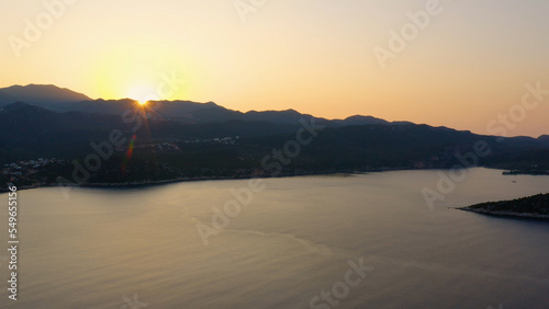 Stunning view of sea bay at sunset time. Beautiful resort town. Nature panorama from above.