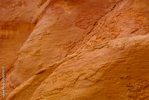 France, Provence-Alpes-Cote dAzur, Wall of ochre cliff in Le Sentier des Ocres quarry photo