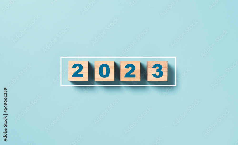 Businessman array wooden cube block with virtual loading bar for count down from 2022 to 2023 year of preparation merry Christmas and happy new year by technology download concept. - obrazy, fototapety, plakaty 
