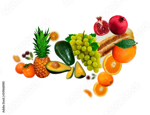 Tasty Juicy. fresh grapes  orange  avokado  pomegranate  ananas  persimmon levitate on a white background  healthy diet. Fresh fruits and vegetables