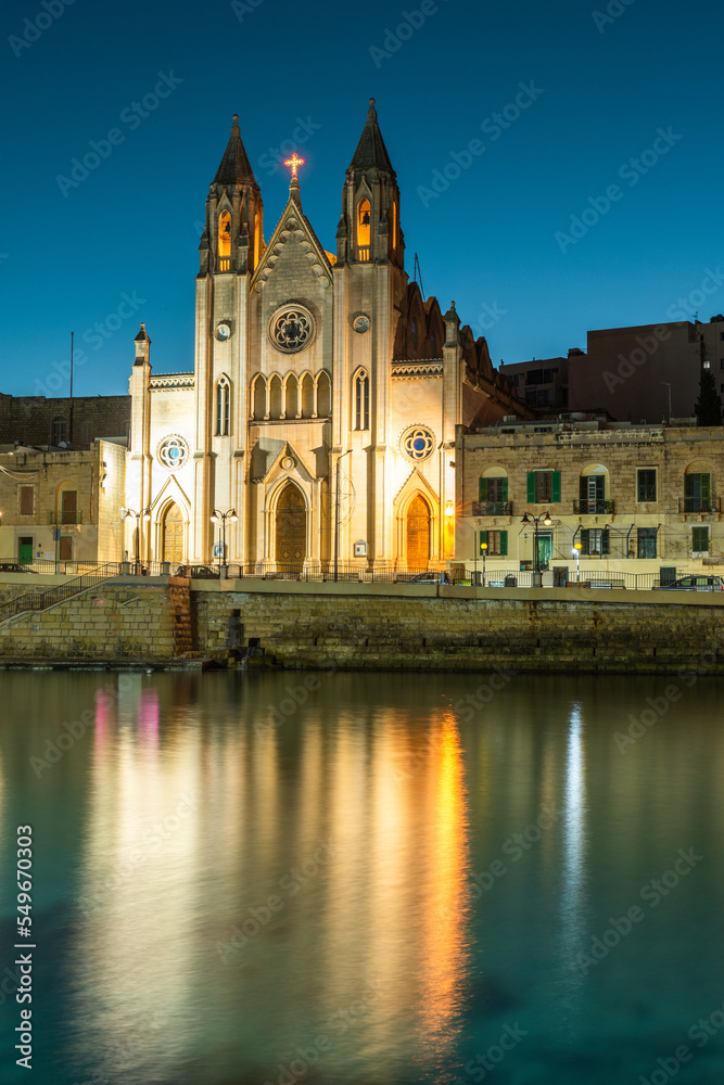 Neo-Gothic church of Our Lady of Mount Carmel (Balluta parish church) at night,  Balluta bay, Malta
