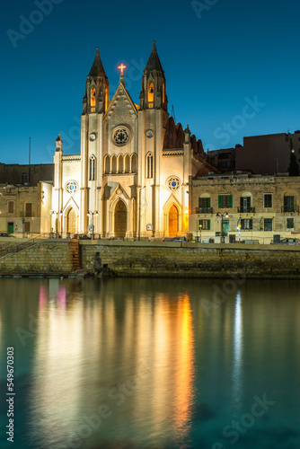 Neo-Gothic church of Our Lady of Mount Carmel (Balluta parish church) at night, Balluta bay, Malta