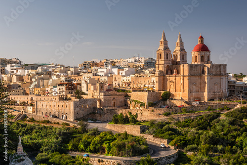 Il-Mellieha, Malta -  Mellieha town at sunny day with Paris Church on hill top photo