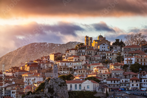 The village of Arachova, Greece, at the slopes of Parnassos mountain during a golden winter sunset photo