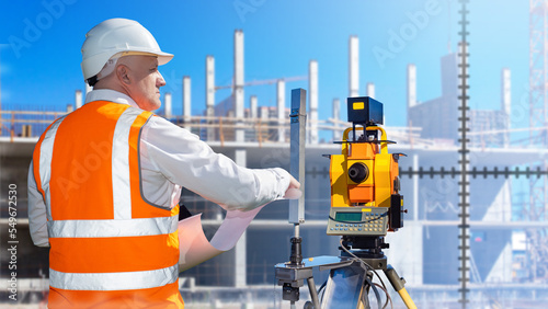 Man surveyor at constructio...