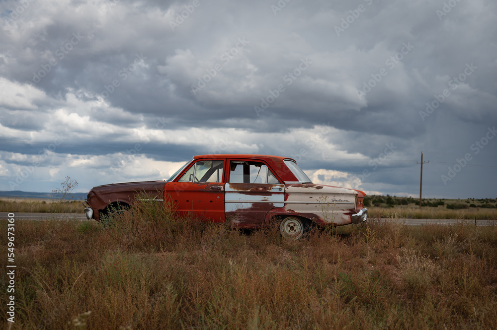 Old first generation Ford Falcon abandoned in the desert Old first generation Ford Falcon abandoned in the desert