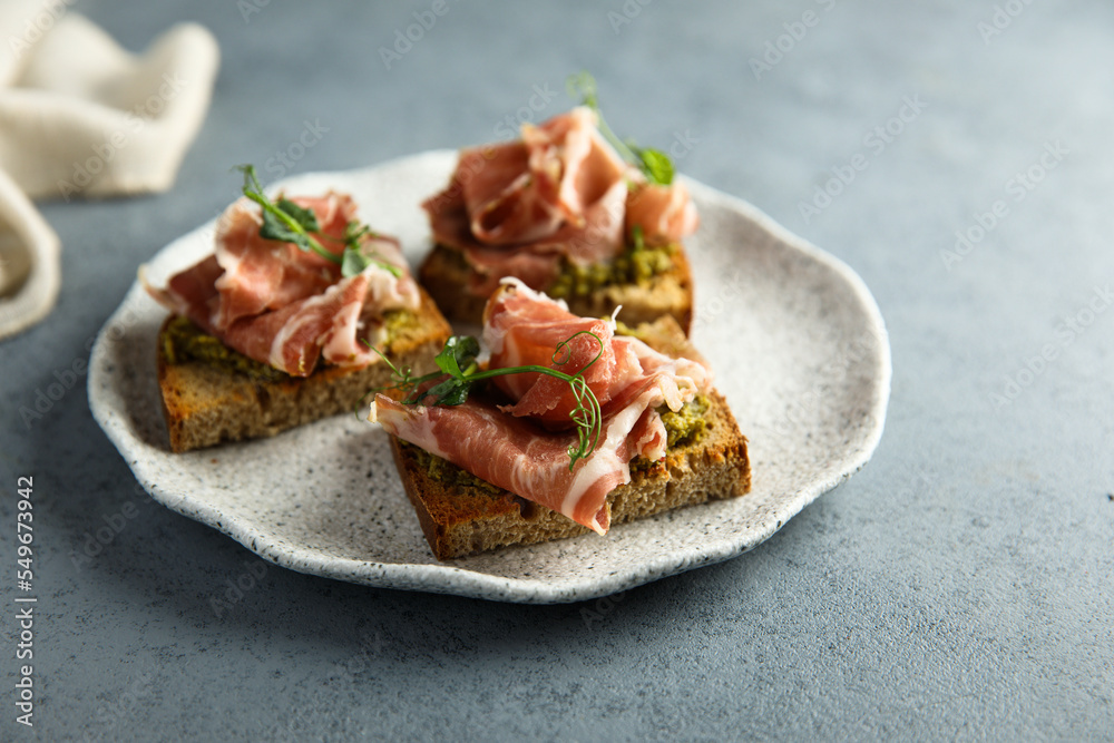 Toasts with ham and pesto