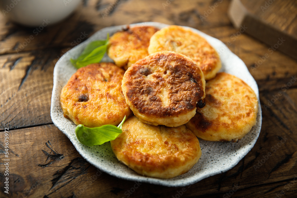 Homemade savory potato pancakes with fresh basil