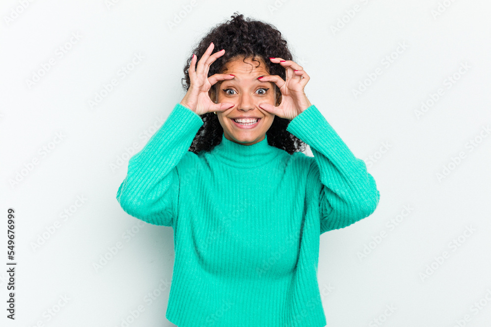 Young african american woman isolated keeping eyes opened to find a success opportunity. Young african american woman isolated keeping eyes opened to find a success opportunity.
