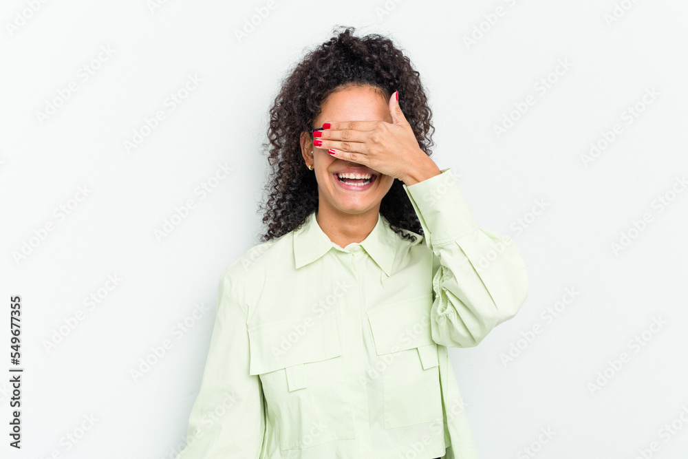 Young african american woman isolated covers eyes with hands, smiles broadly waiting for a surprise.