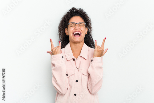 Foto Young african american woman isolated showing a horns gesture as a revolution concept