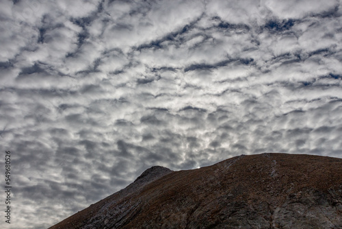 Mountain named Gra de Fajol with Cirrocumulus sky