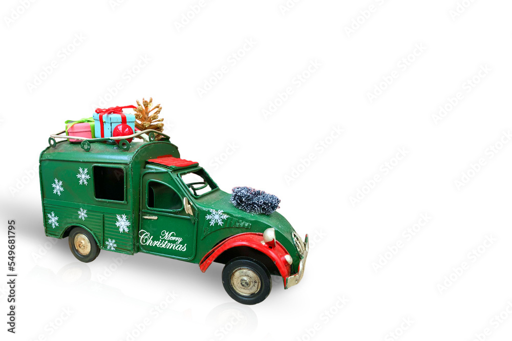 Christmas decoration. The car is carrying Christmas gifts. Isolated on white background
