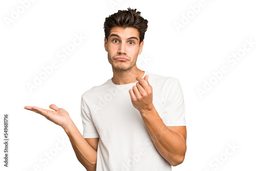 Obraz na plátně Young caucasian handsome man isolated showing that she has no money