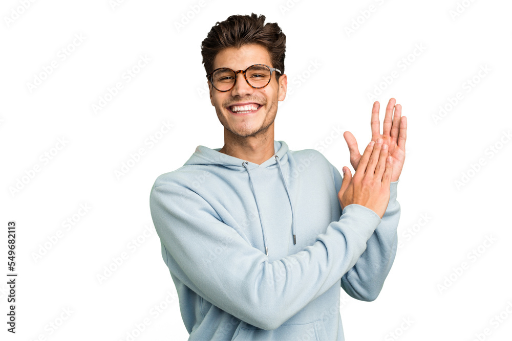 Young caucasian handsome man isolated feeling energetic and comfortable, rubbing hands confident. Young caucasian handsome man isolated feeling energetic and comfortable, rubbing hands confident.