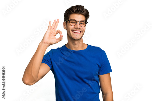 Fotografie Young caucasian handsome man isolated cheerful and confident showing ok gesture