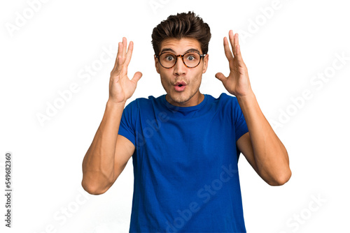 Canvastavla Young caucasian handsome man isolated celebrating a victory or success, he is surprised and shocked