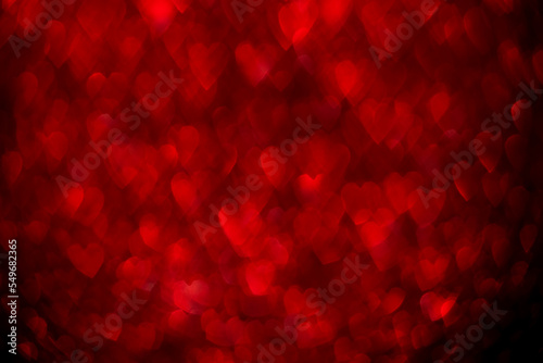 Red hearts, sparkling glitter bokeh background, valentines day abstract defocused texture