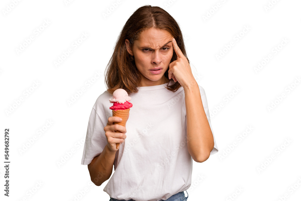 Young caucasian woman holding an ice cream isolated pointing temple with finger, thinking, focused on a task. Young caucasian woman holding an ice cream isolated pointing temple with finger, thinking, focused on a task.