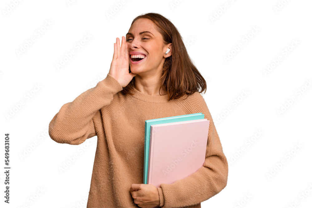 Young student woman holding a books isolated shouting and holding palm near opened mouth. Young student woman holding a books isolated shouting and holding palm near opened mouth.