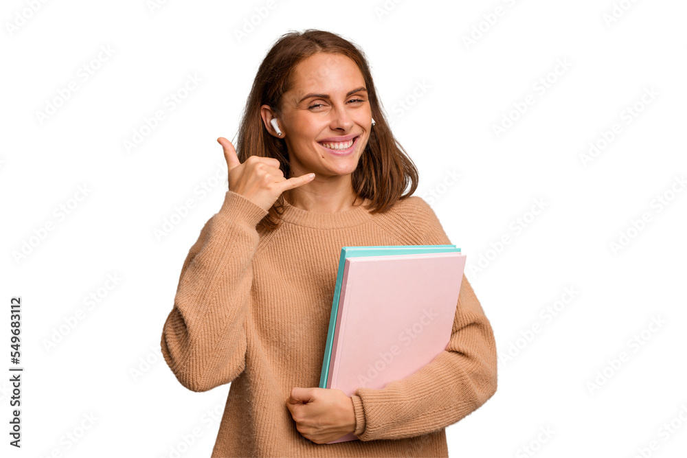 Young student woman holding a books isolated showing a mobile phone call gesture with fingers. Young student woman holding a books isolated showing a mobile phone call gesture with fingers.