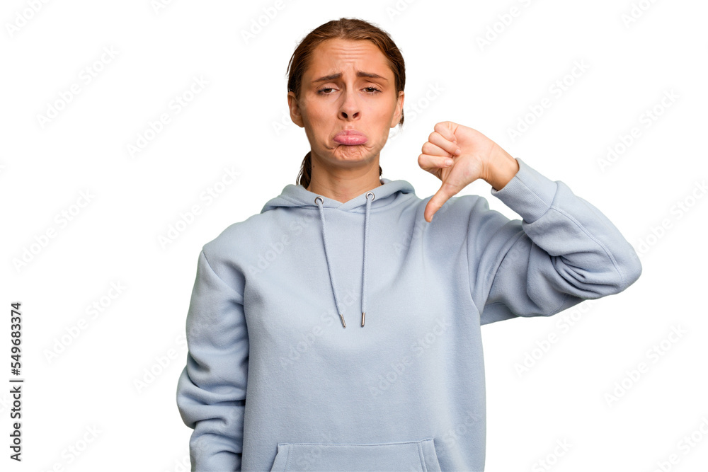 Young caucasian woman isolated showing a dislike gesture, thumbs down. Disagreement concept. Young caucasian woman isolated showing a dislike gesture, thumbs down. Disagreement concept.