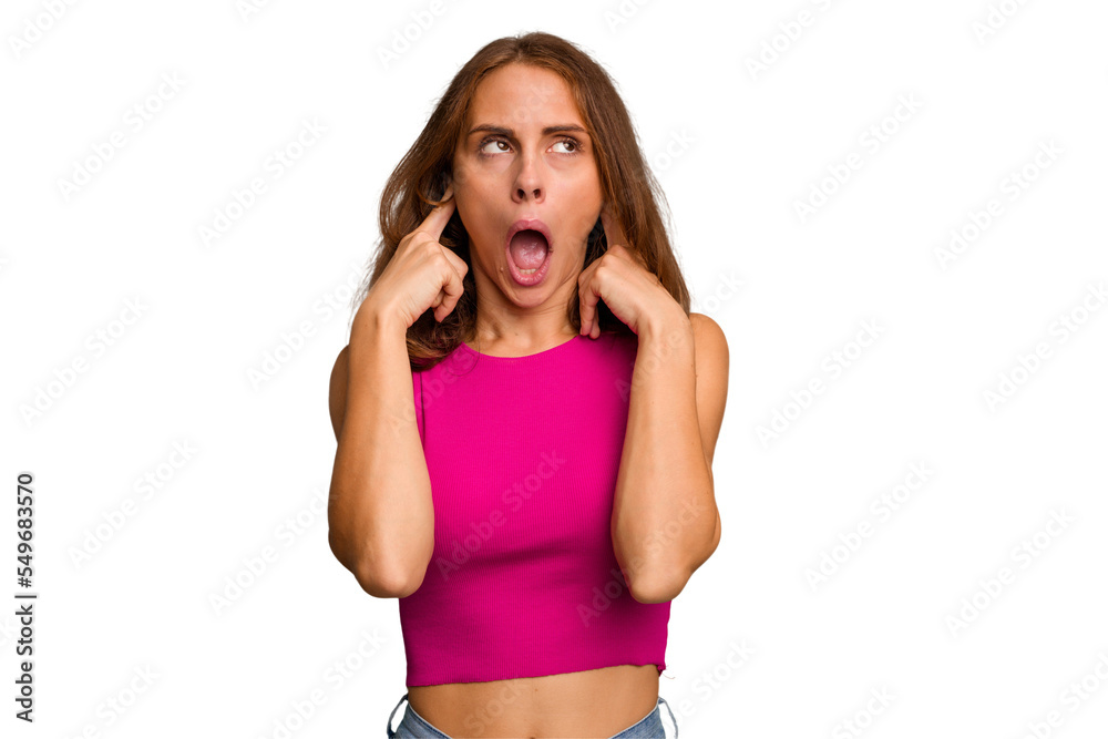 Young caucasian woman isolated covering ears with fingers, stressed and desperate by a loudly ambient. Young caucasian woman isolated covering ears with fingers, stressed and desperate by a loudly ambient.