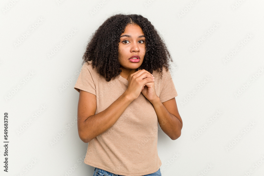 Young african american woman isolated on white background scared and afraid. Young african american woman isolated on white background scared and afraid.