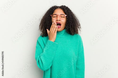 Young african american woman isolated on white background yawning showing a tired gesture covering mouth with hand.
