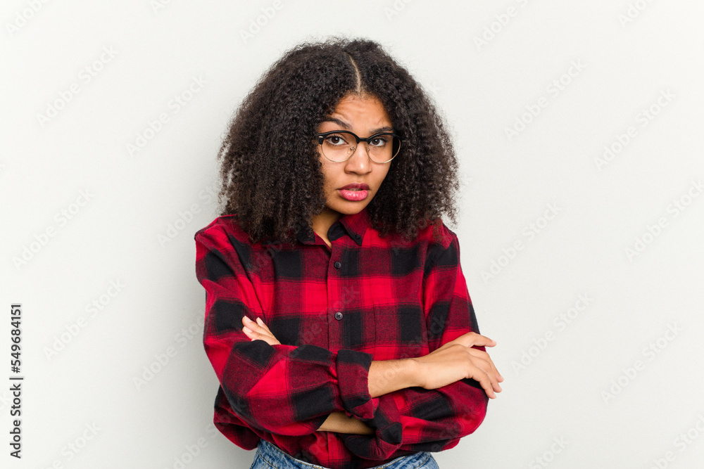 Young african american woman isolated on white background who is bored, fatigued and need a relax day. Young african american woman isolated on white background who is bored, fatigued and need a relax day.
