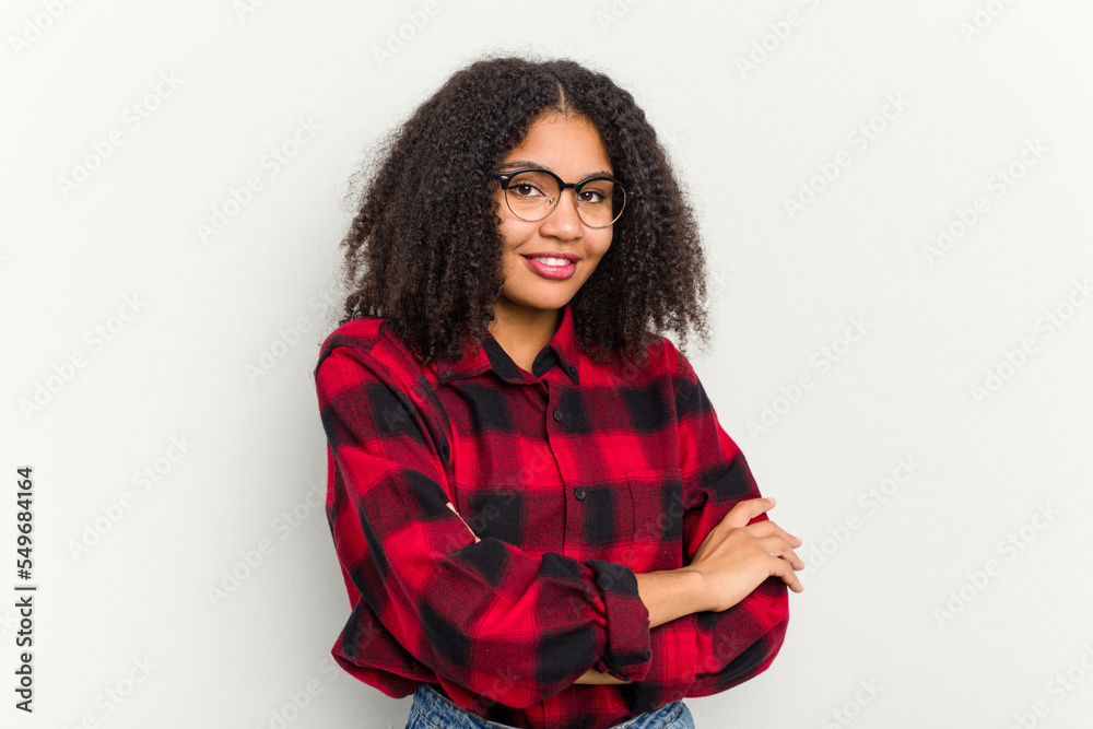 Young african american woman isolated on white background who feels confident, crossing arms with determination. Young african american woman isolated on white background who feels confident, crossing arms with determination.