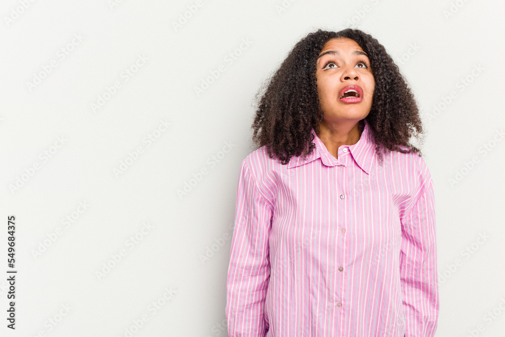 Young african american woman isolated on white background shouting very angry, rage concept, frustrated. Young african american woman isolated on white background shouting very angry, rage concept, frustrated.