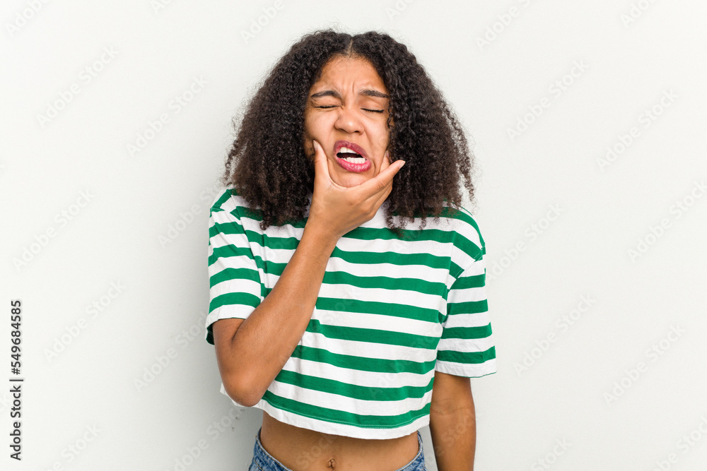 Young african american woman isolated on white background having a strong teeth pain, molar ache. Young african american woman isolated on white background having a strong teeth pain, molar ache.