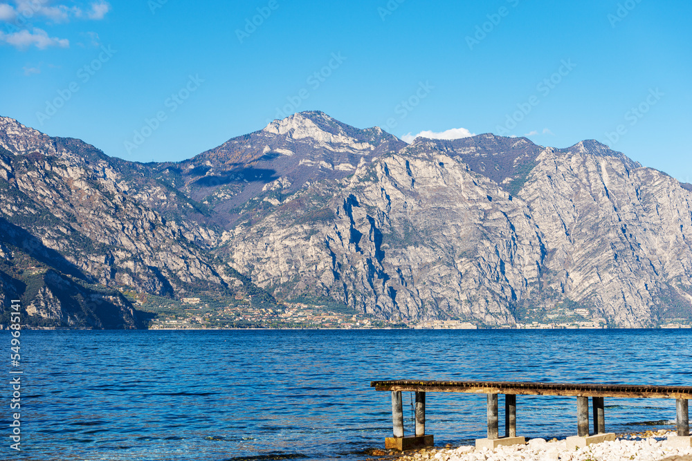 Lake Garda (Lago di Garda) and Italian Alps with the small village of Limone sul Garda view from the Malcesine village. Italy, Veneto and Lombardy, southern Europe. 