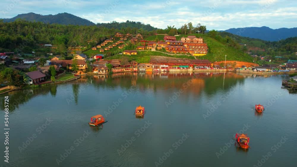 Drone is flying over a Chinese village in Thailand, “Ban Rak Thai” Lake early morning. Famous tourist attractions in Thailand. aerial view. Mae Hong Son, Northern Thailand. Southeast asia. 4K
Drone is flying over a Chinese village in Thailand, “Ban Rak Thai” Lake early morning. Famous tourist attractions in Thailand. aerial view. Mae Hong Son, Northern Thailand. Southeast asia. 4K